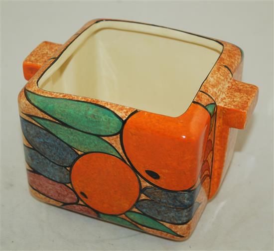 A Clarice Cliff Oranges pattern cafe au lait ground square biscuit barrel, shape 479, 18cm